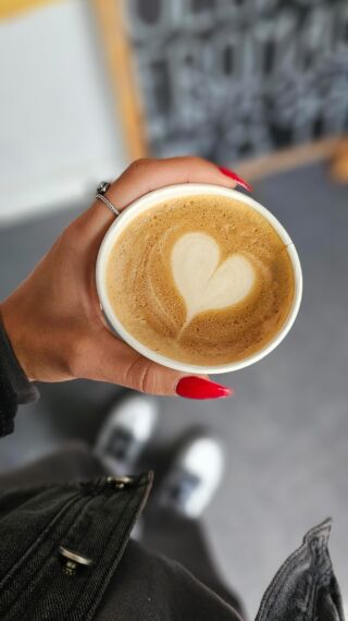 Hand holding cup